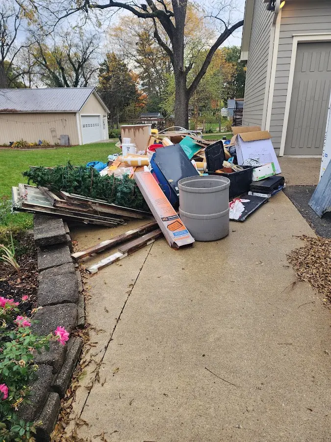 Dumpster being loaded with debris for 3 Yard Dumpster Rental in Erlanger